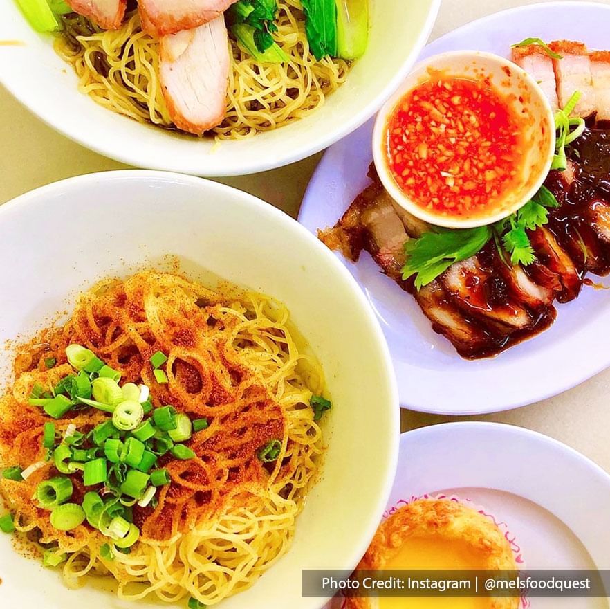 a photo of the famous Tok Tok Mee Bamboo Noodle served alongside steamed chicken and pork trotter.