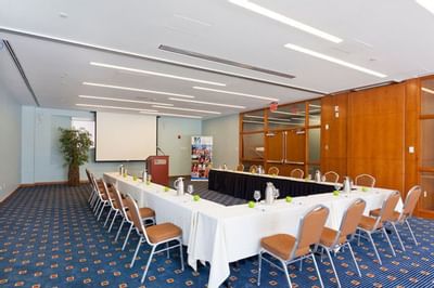 U-shaped table setup for a meeting at UMass Lowell Inn