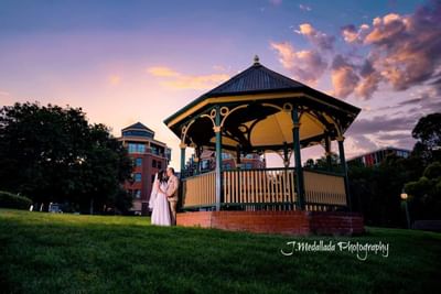 Wedded couple by the gazebo at  Amora Hotel Melbourne