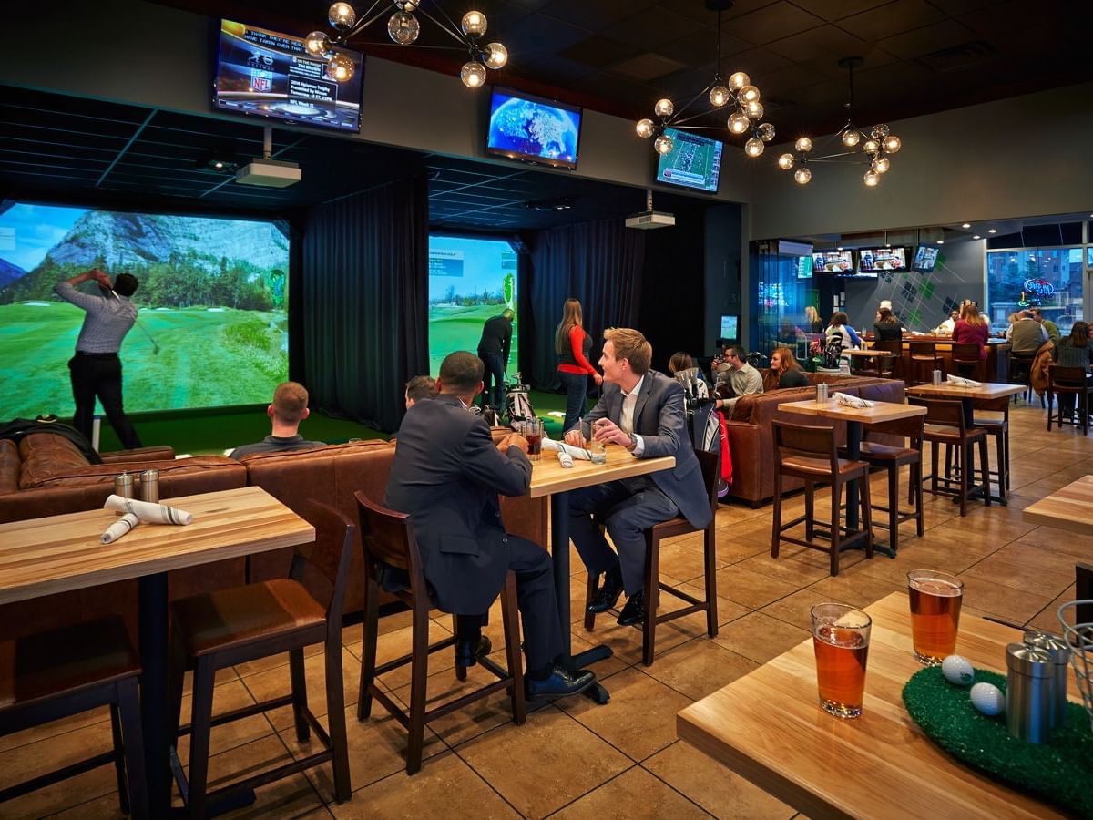 people watching sports in a restaurant area