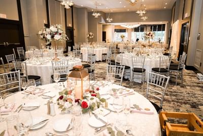 banquet room with elegantly decorated tables and chairs