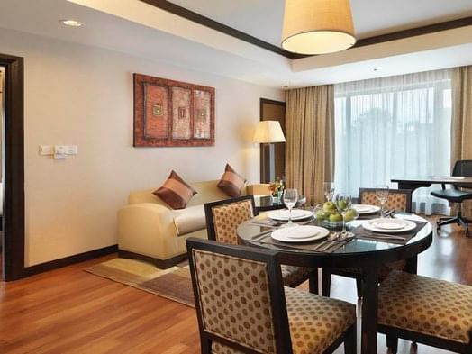 Living area with dining table in One Bedroom Premier Suite at MiCasa All Suite Hotel KL