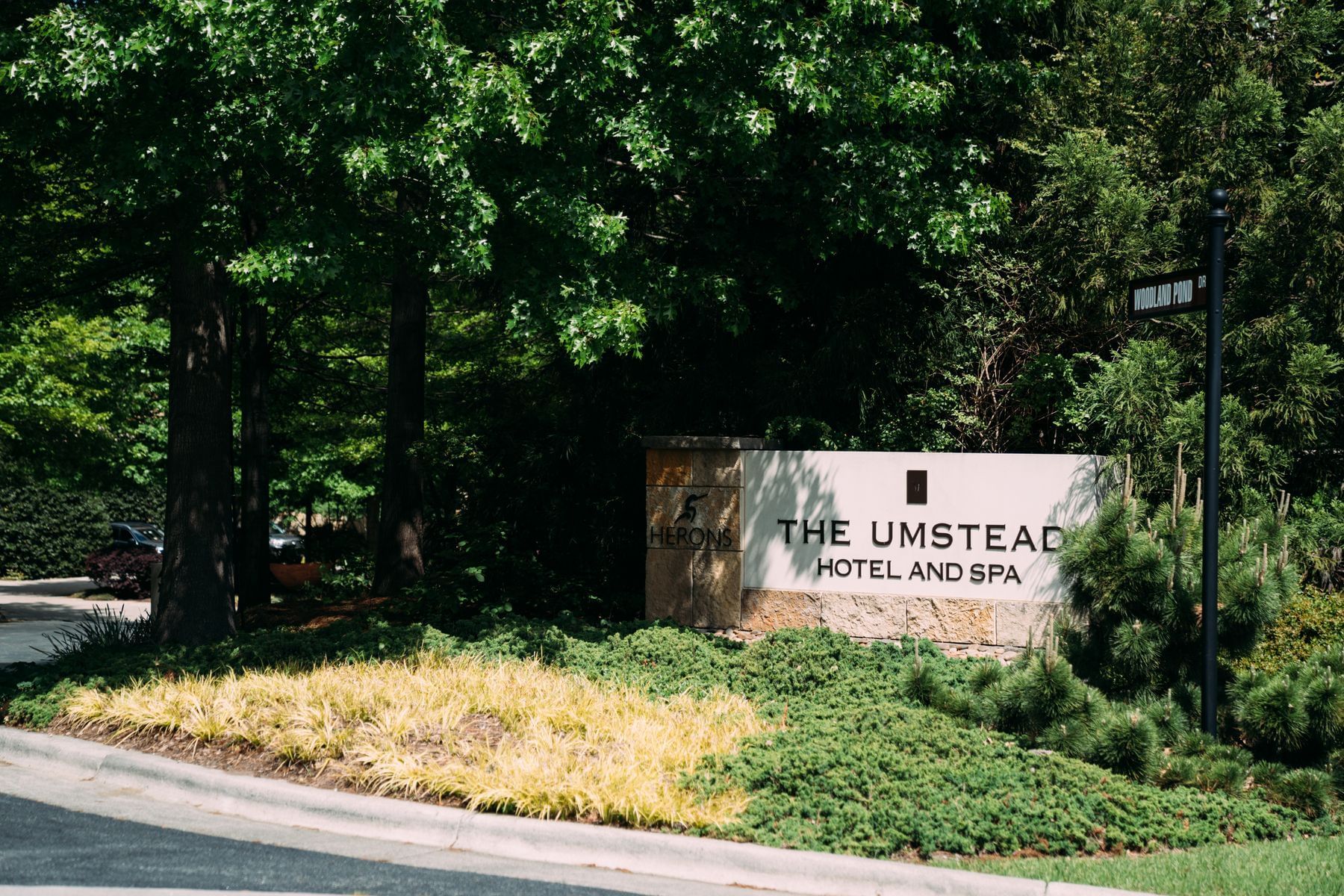 The hotel logo & the sign by the entrance at Umstead Hotel and Spa