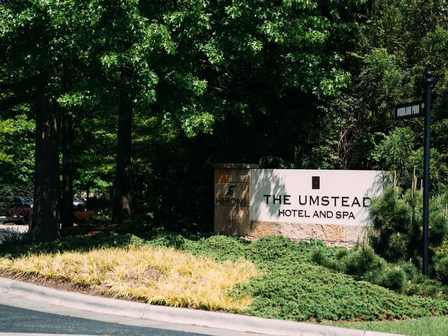 The hotel logo & the sign by the entrance at Umstead Hotel and Spa