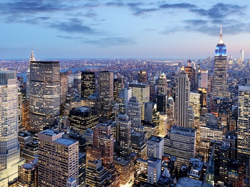 The Midtown Manhattan skyline at blue hour with skyscrapers like the Chrysler Building lit up in New York City