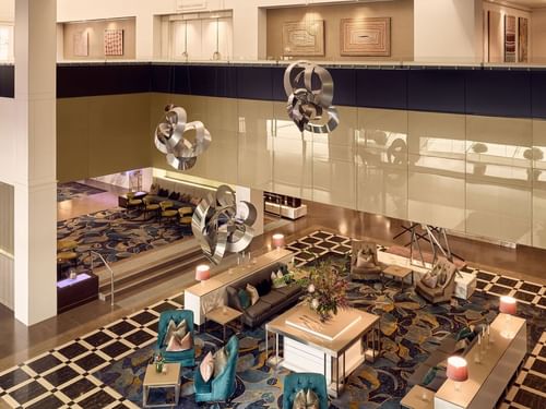 Sofitel Brisbane Central hotel lobby with plush seating and decorative floor pattern