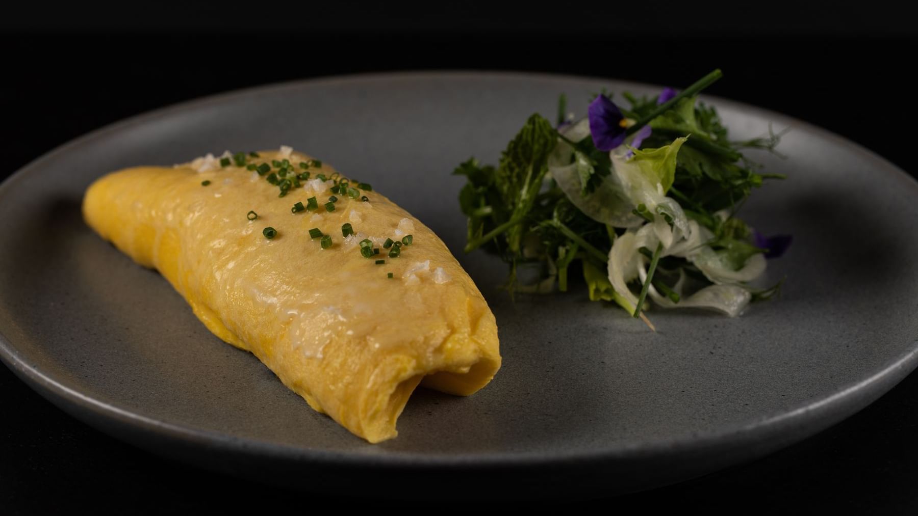 Delicious omelet & side salad served at The Townsend Hotel