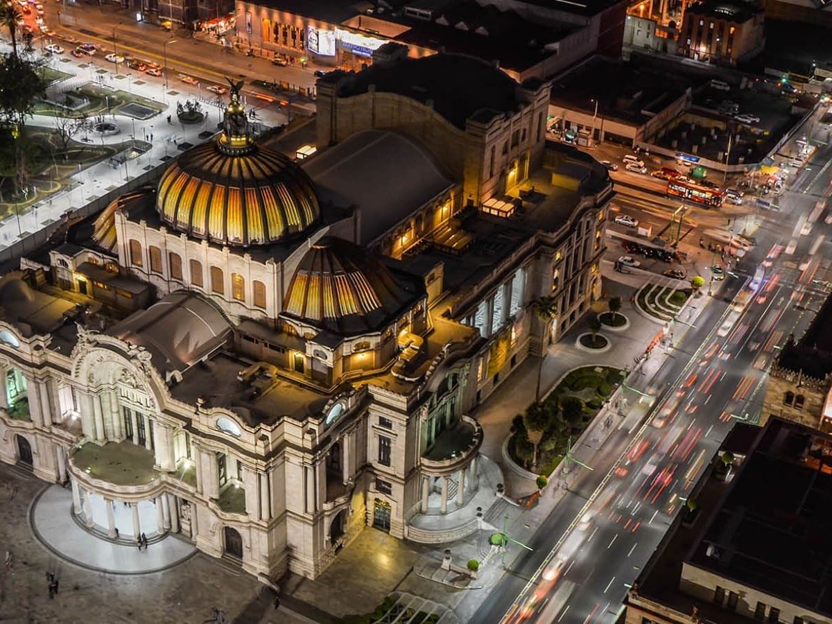 Aerial view of Palacio de Bellas Artes at night near One Hotels