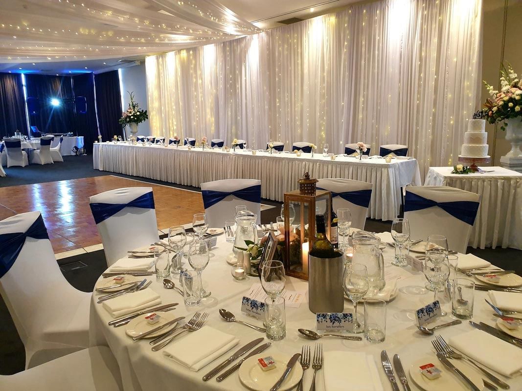 Table set-up arrangement in wedding hall at Mercure Kooindah Waters