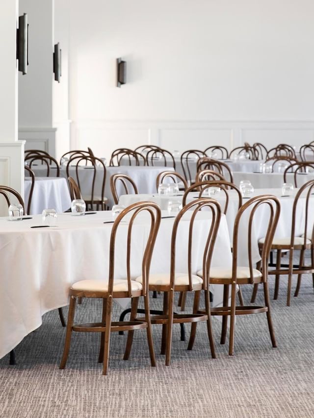 Fairy Bower at Elysium Manly with bentwood chairs surrounding white tables, highlighting top Manly event venues