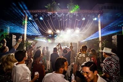 People partying outdoors at The Morgan Resort Spa Village