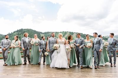 A bride & groom posing outdoors at Stein Eriksen Lodge