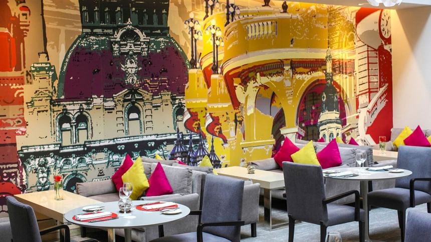 Dining hall with mural at Grand Hotels Lux
