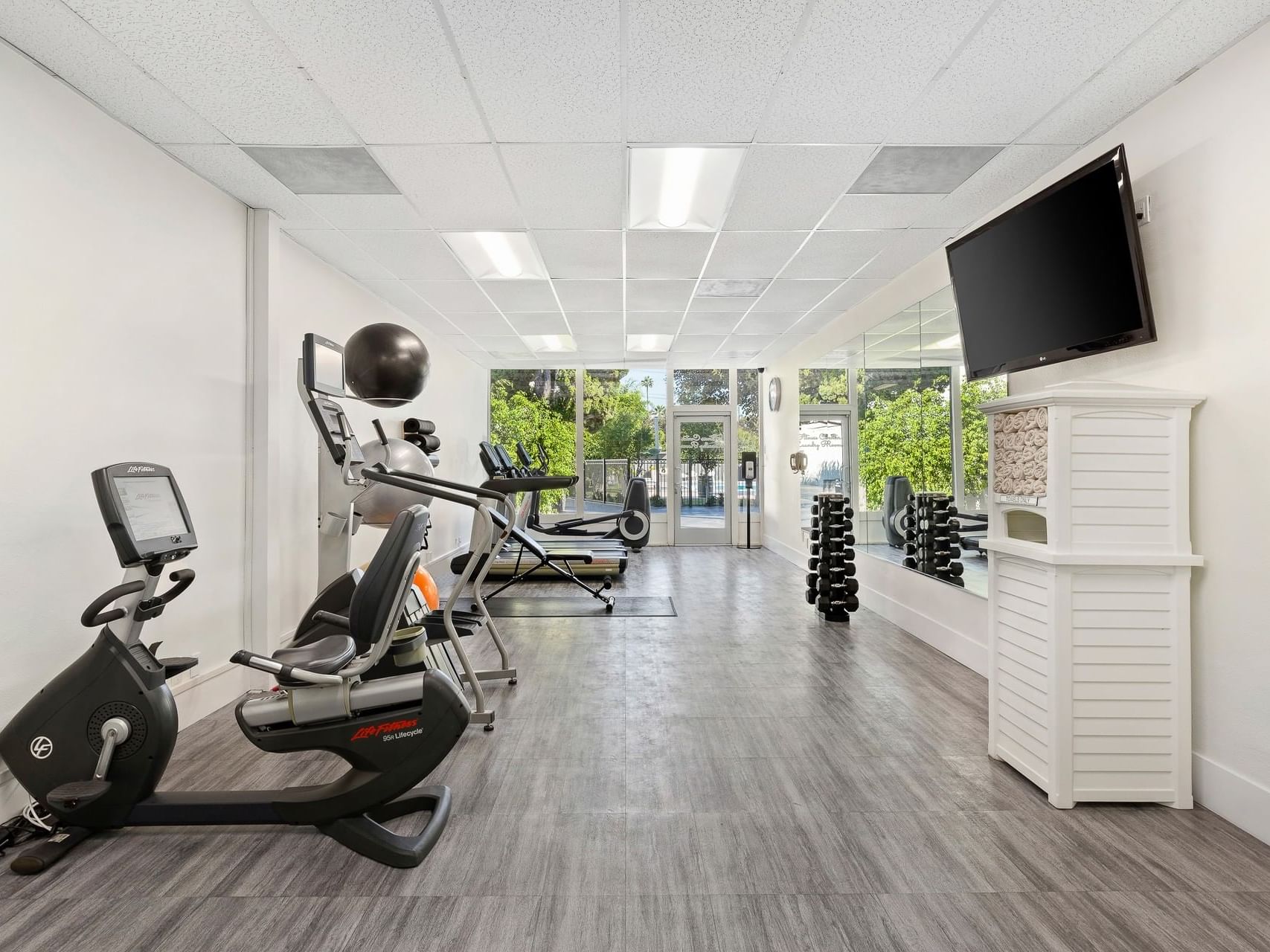 Interior of a fully equipped gymnasium at Anaheim Hotel
