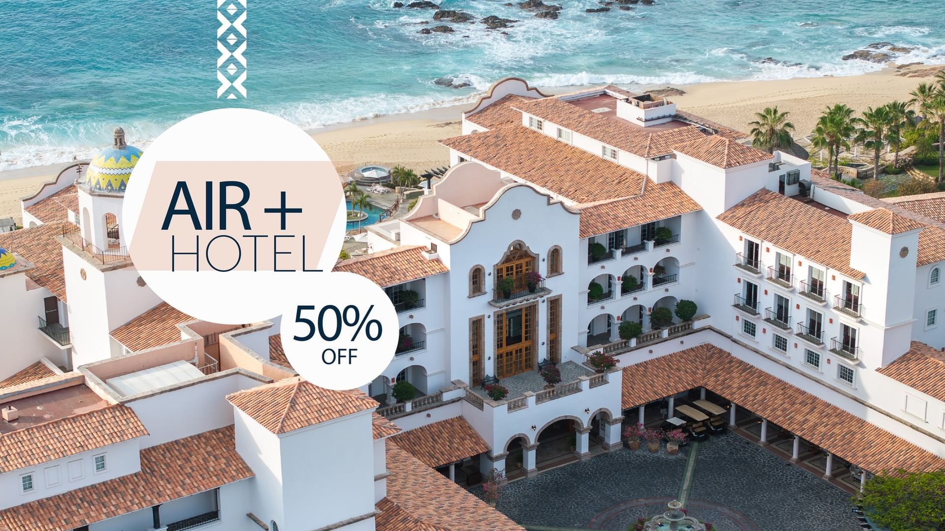 Hotel with beach view, circular fountain, and 