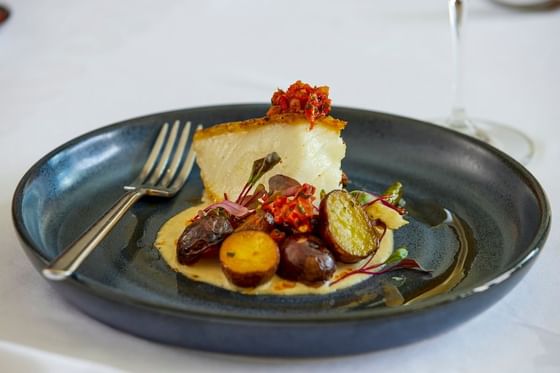 Halibut with pickled vegetables dish served in Glitretind Restaurant at Stein Eriksen Lodge