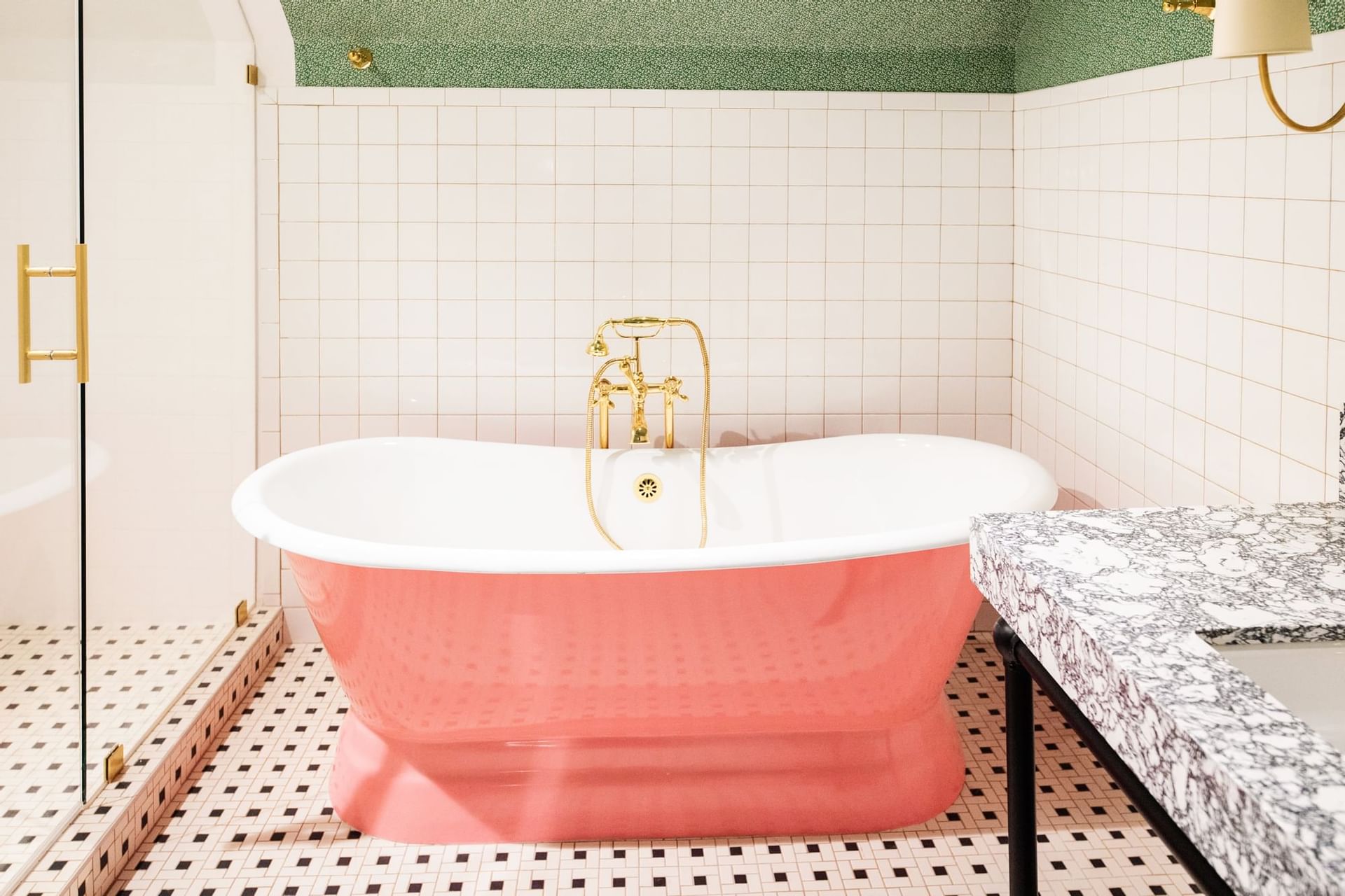 pink bathtub in boutique bathroom