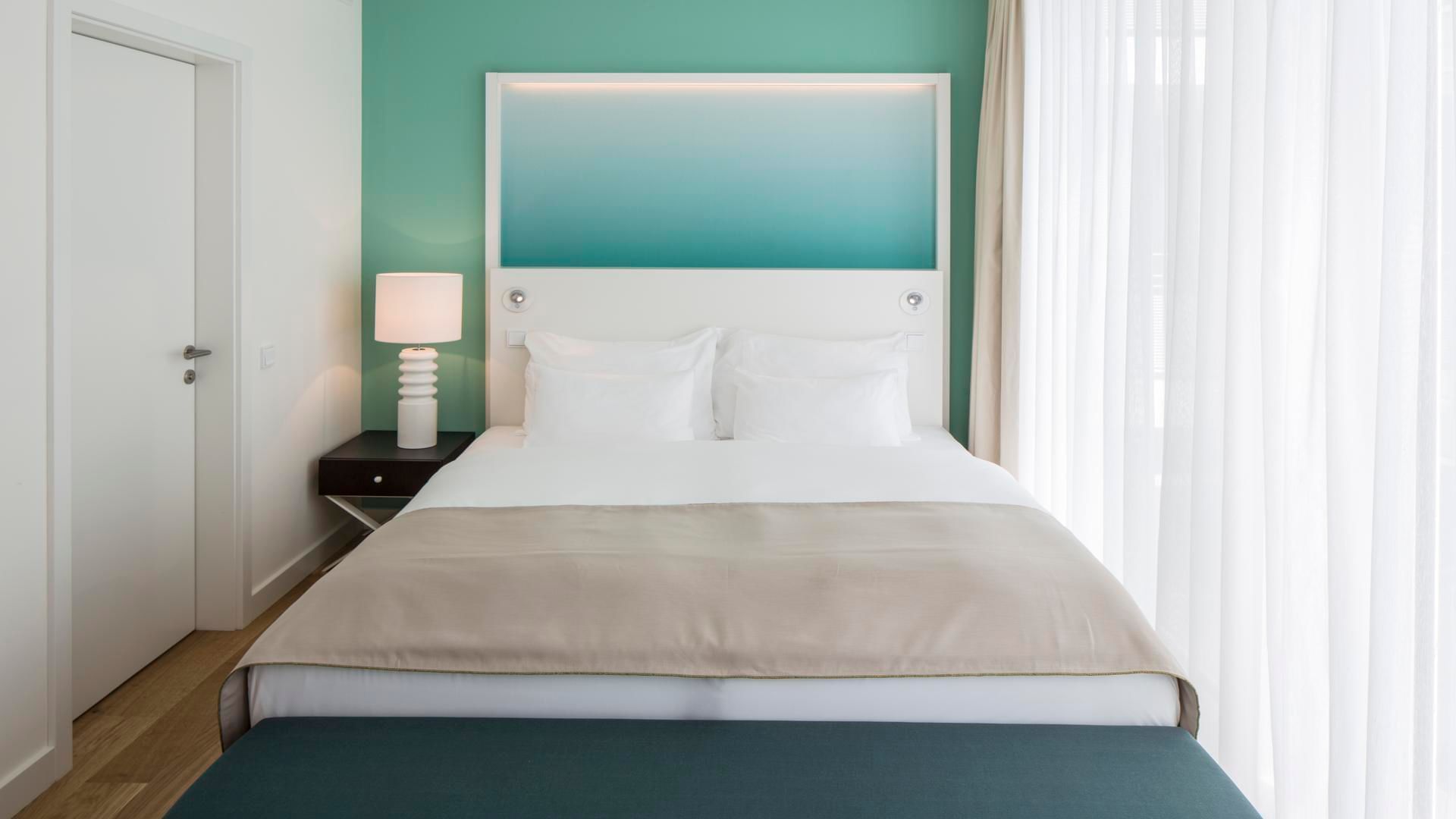 Bed in Barefoot Suite Deluxe sea view at Falkensteiner Hotels