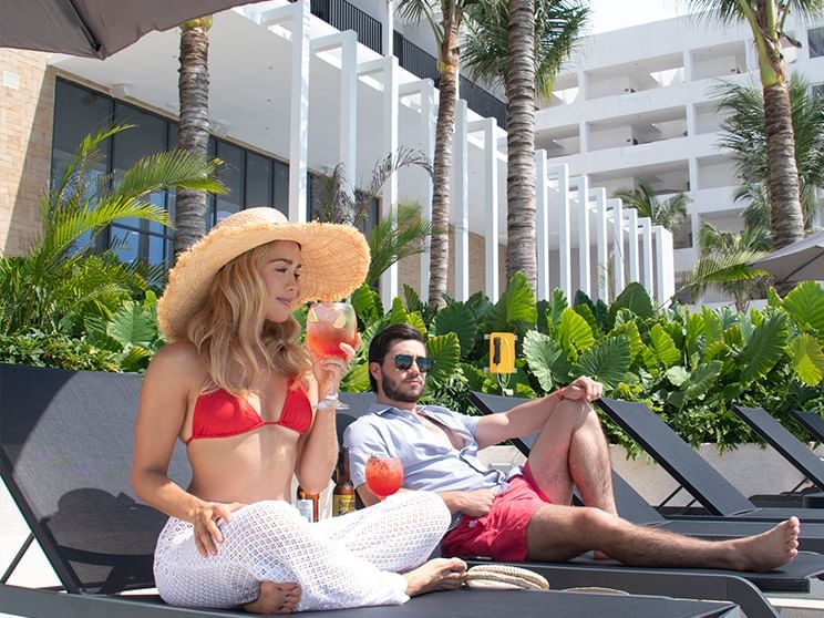 Couple enjoying at pool snack bar at Viaggio Resort Mazatlan