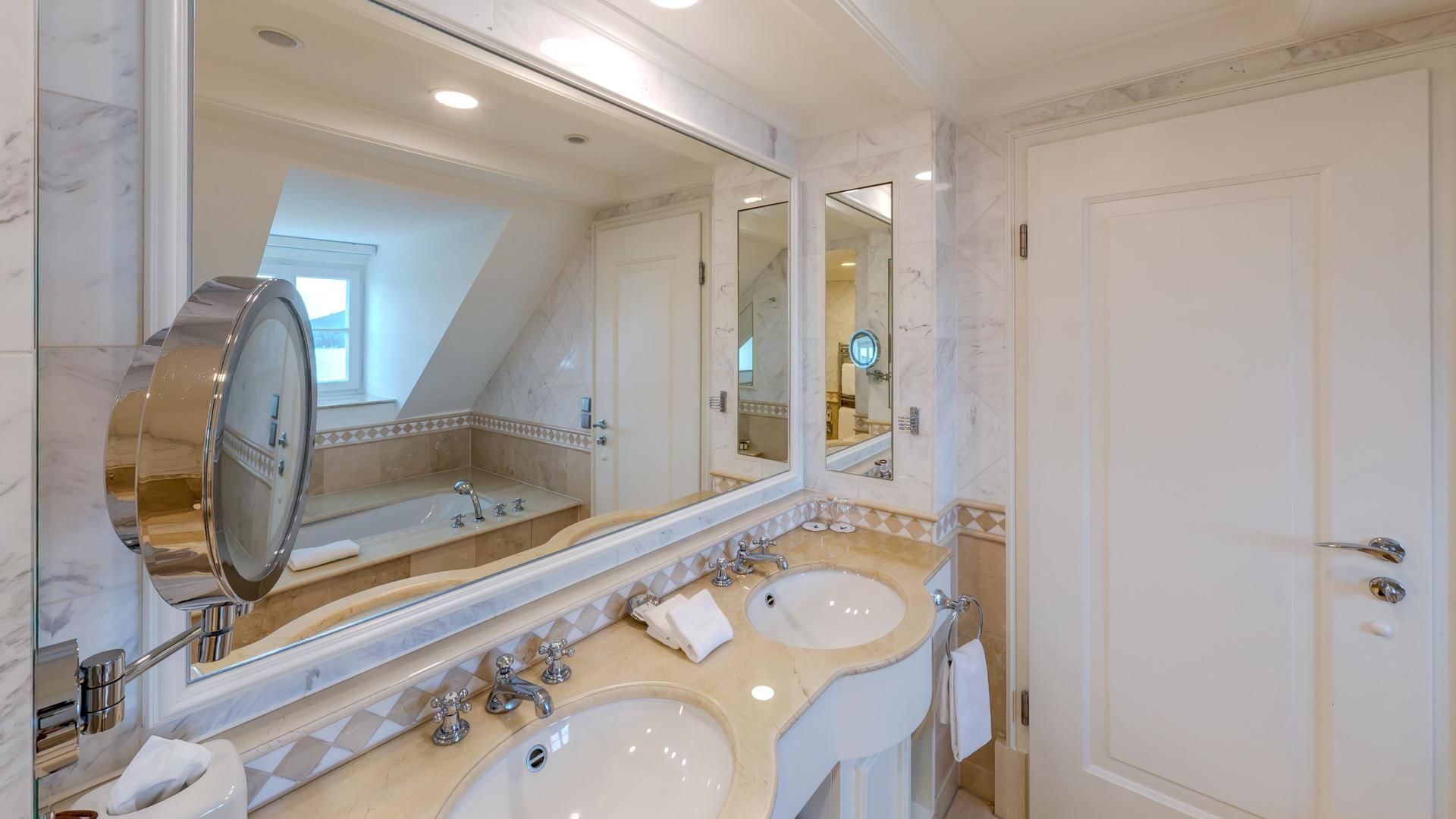 Bathroom vanity in Deluxe Room at Falkensteiner Hotels