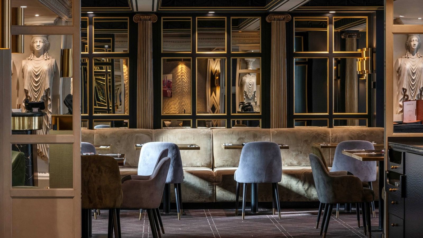 Stylish restaurant interior with velvet seating and gold accents at Hotel Barsey by Warwick