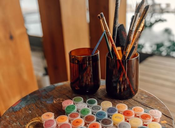 Art supplies ready for a creative session on a rustic table at the beautiful Ibagari Hotel