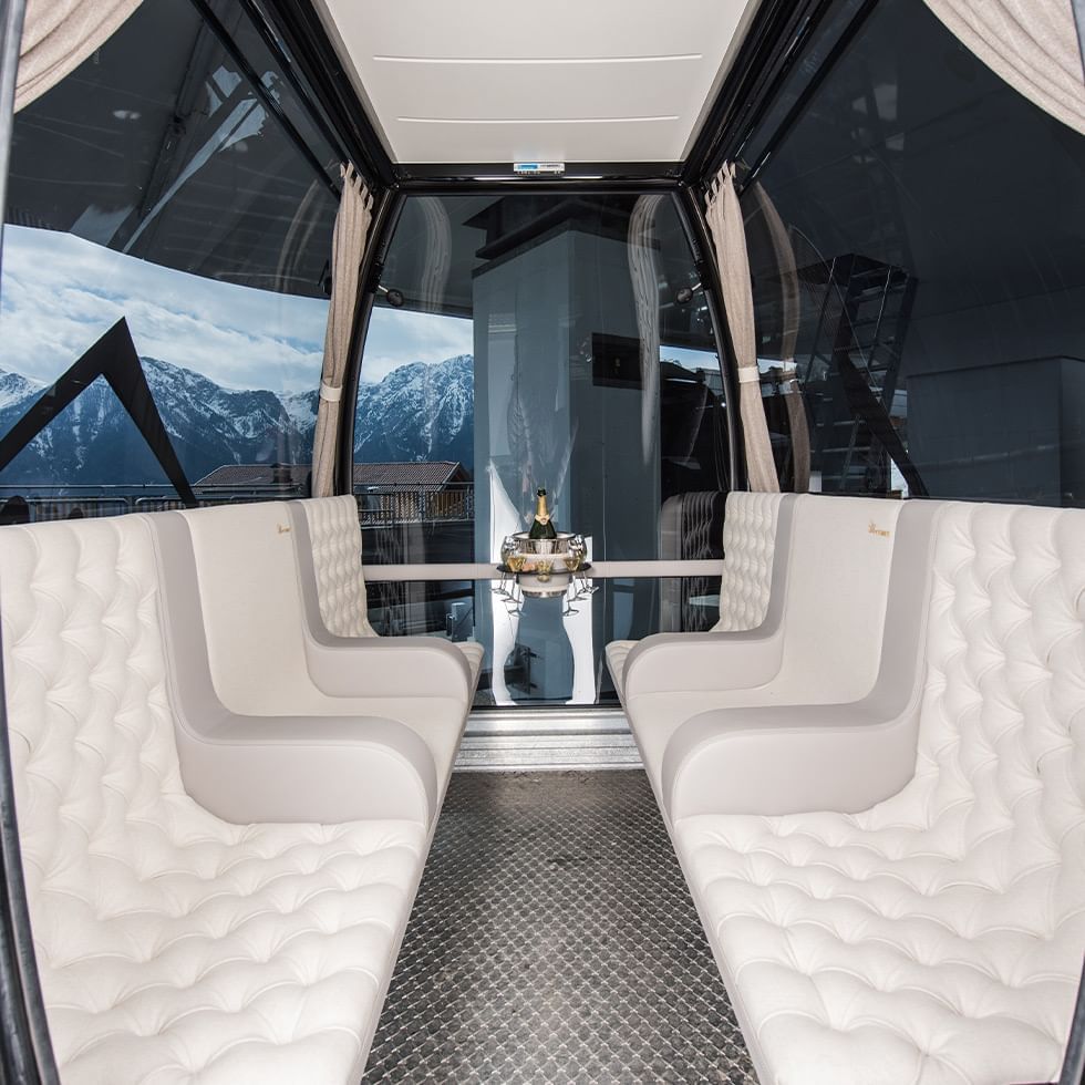 Seating area in a VIP cable car near Falkensteiner Hotels