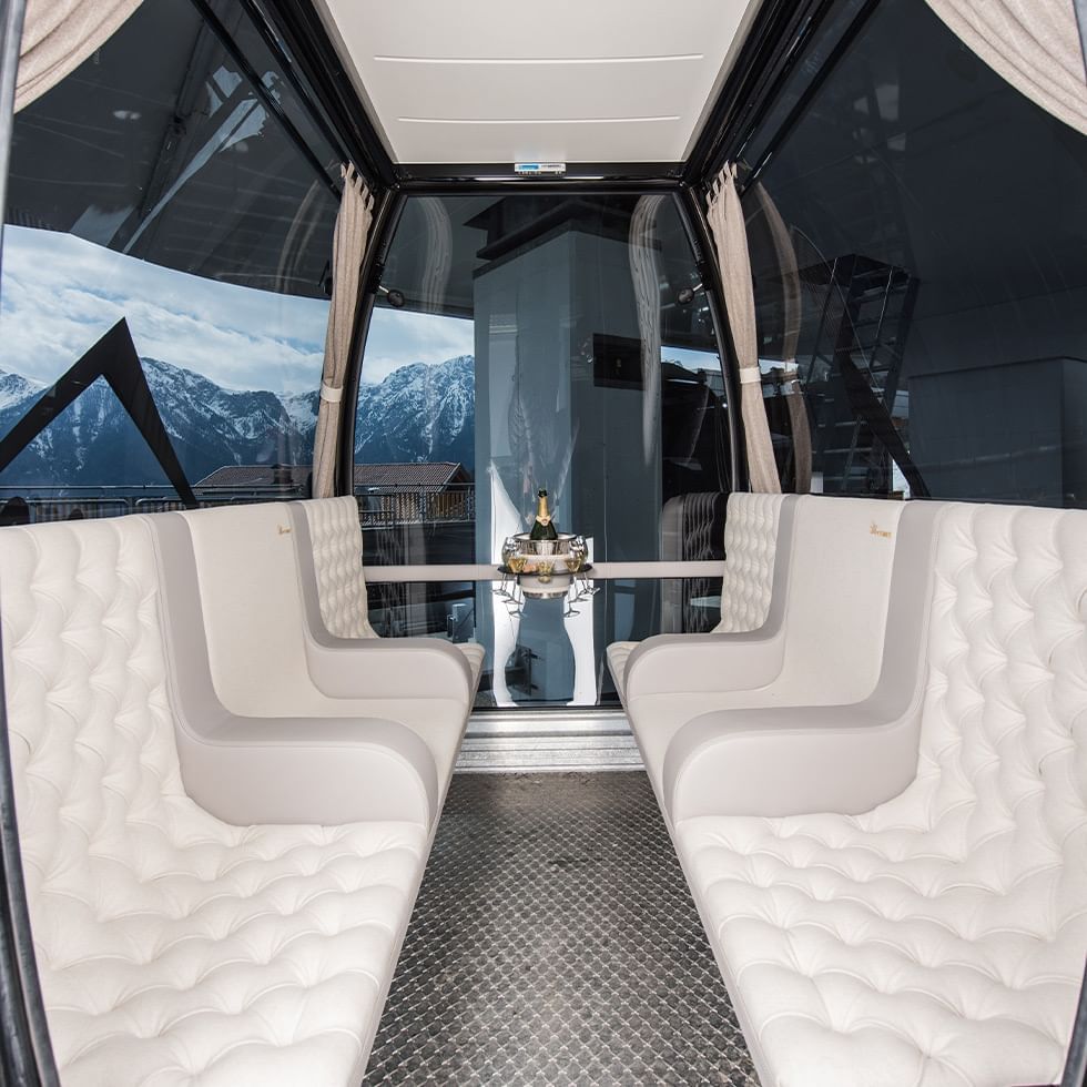 Seating area in a VIP cable car near Falkensteiner Hotel Kronplatz