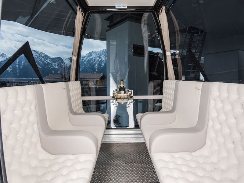 Seating area in a VIP cable car near Falkensteiner Hotels