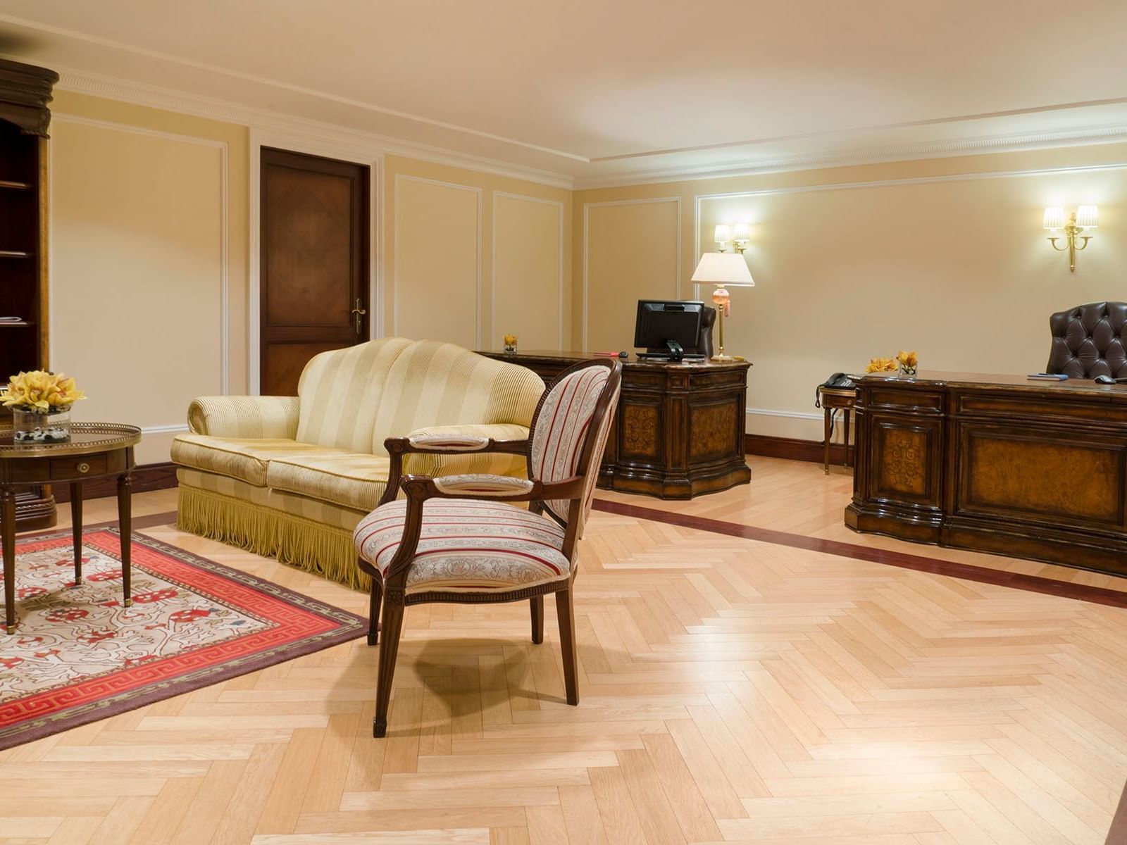 Couch & an armchair in the Business Center at The Regency Hotel