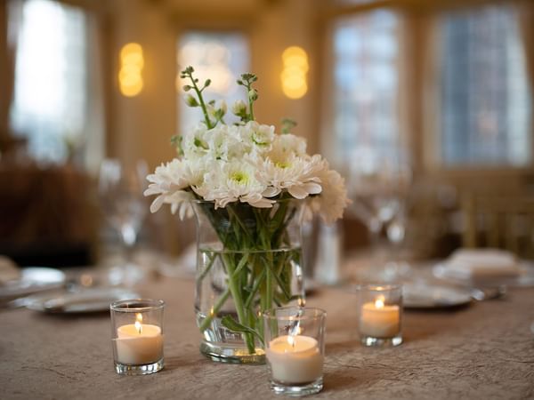 Flower & candle decors on a wedding table at Warwick Allerton