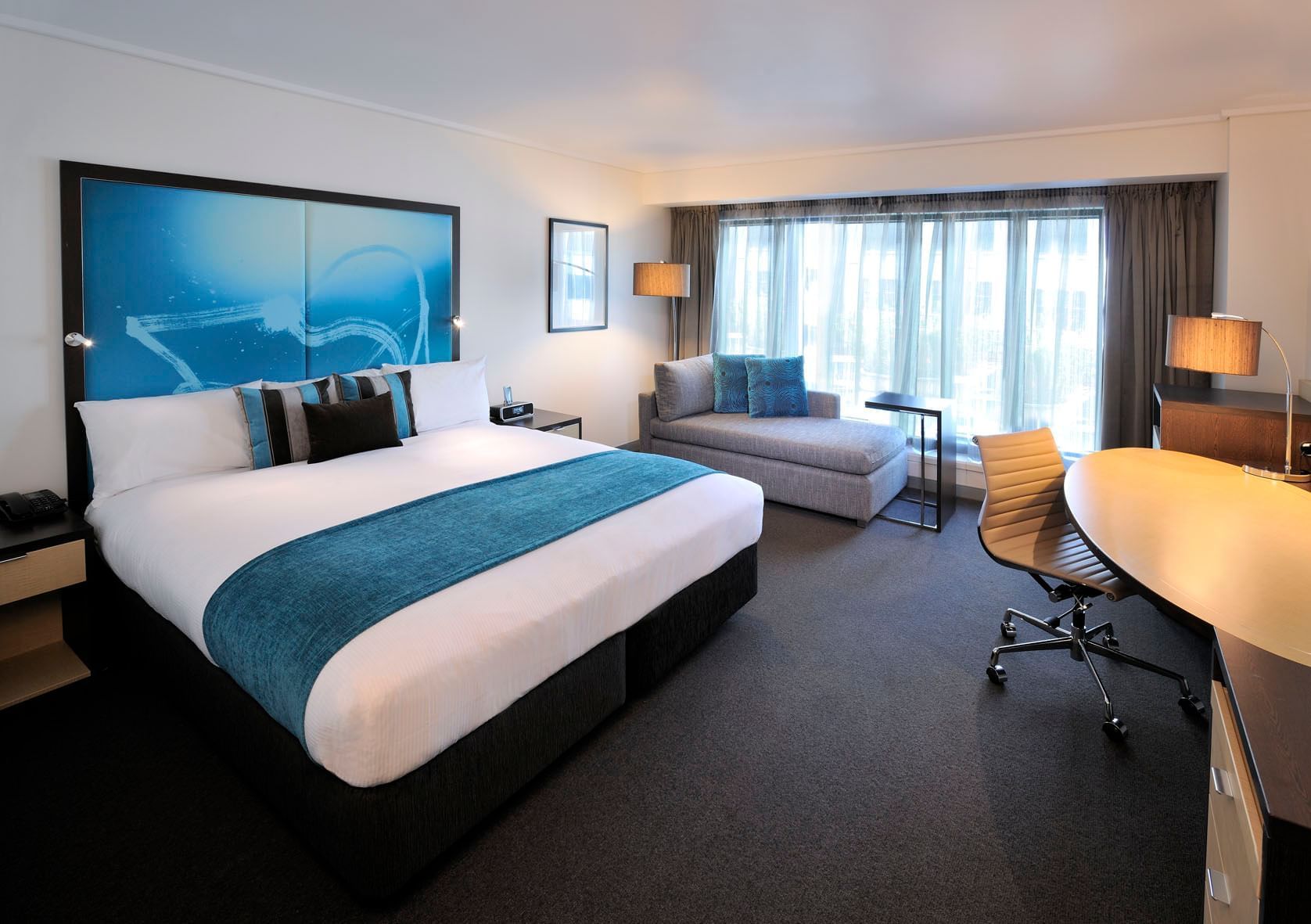 Interior of room with king bed at Novotel Melbourne on Collins