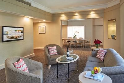 Living area with carpeted floors in Deluxe Suites at York Hotel Singapore