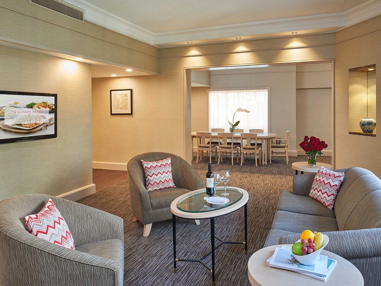 Living area with carpeted floors in Deluxe Suites at York Hotel Singapore