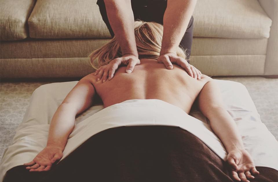 a woman receiving a back massage