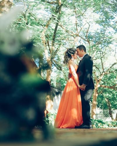 A wedding couple posing together at outdoor near Club Hemingway