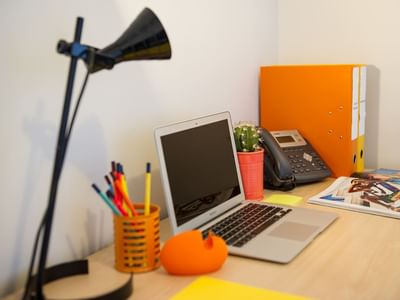 Each apartment includes a large study desk with chair