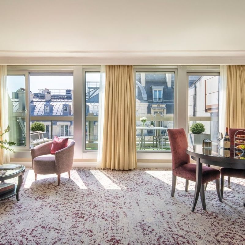 Elegant hotel suite with panoramic view and modern furnishings featuring Pay 3, Stay 4 offer.