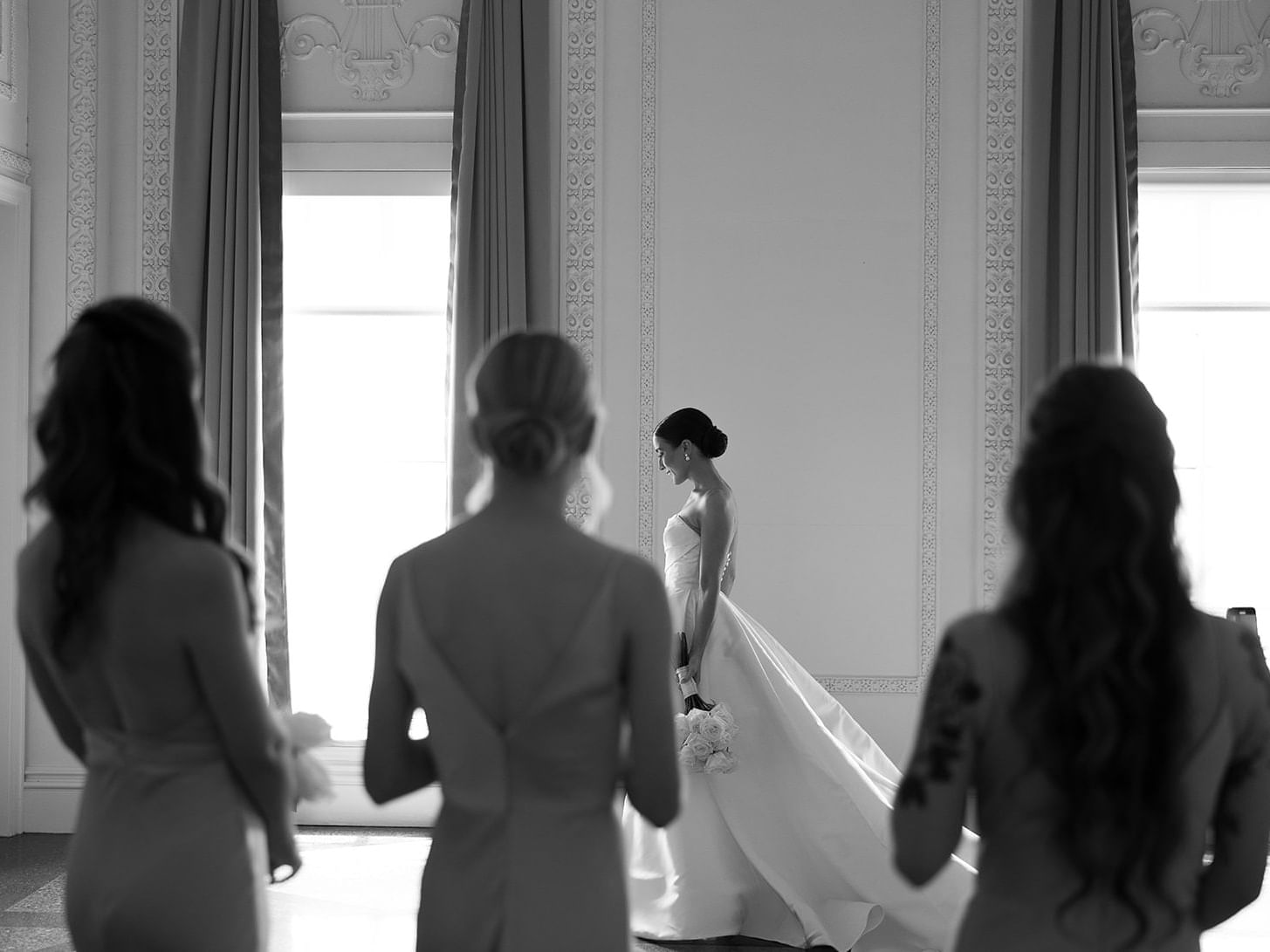 Bride with her wedding party posing at The Mayo Hotel