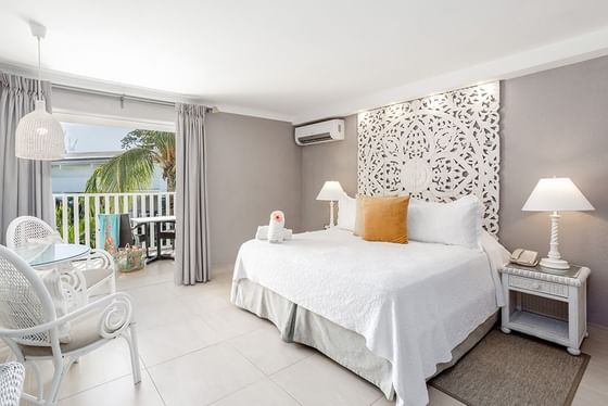 King bed with chair in Signature Room, Sugar Bay Barbados