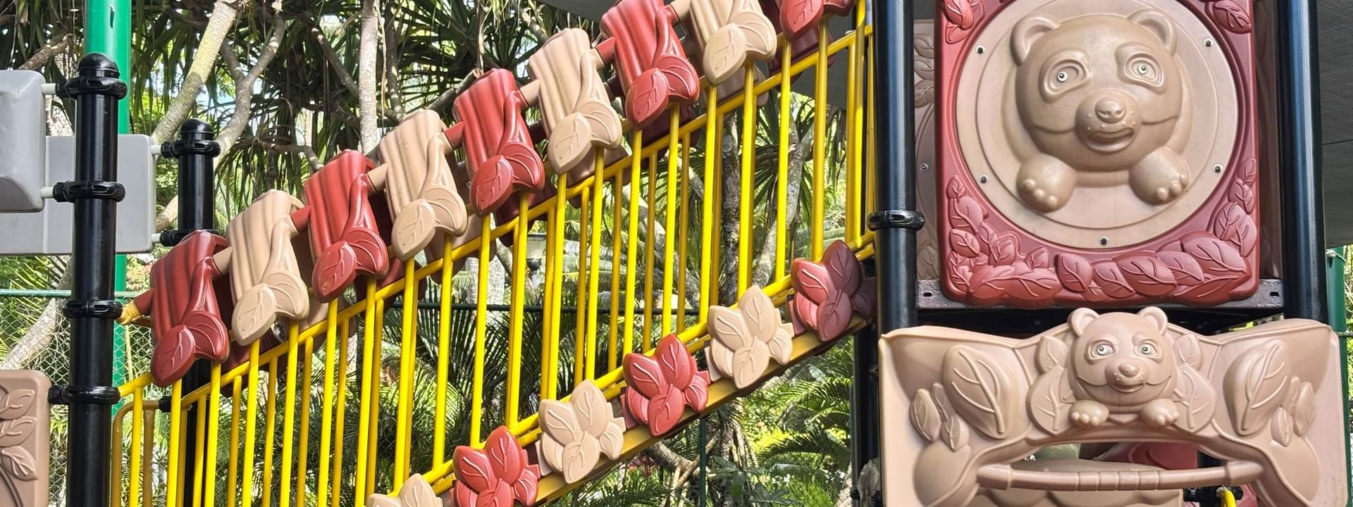 Colorful kids playground with bear designs and a canopy at Warwick Fiji Resort and Spa, Korolevu