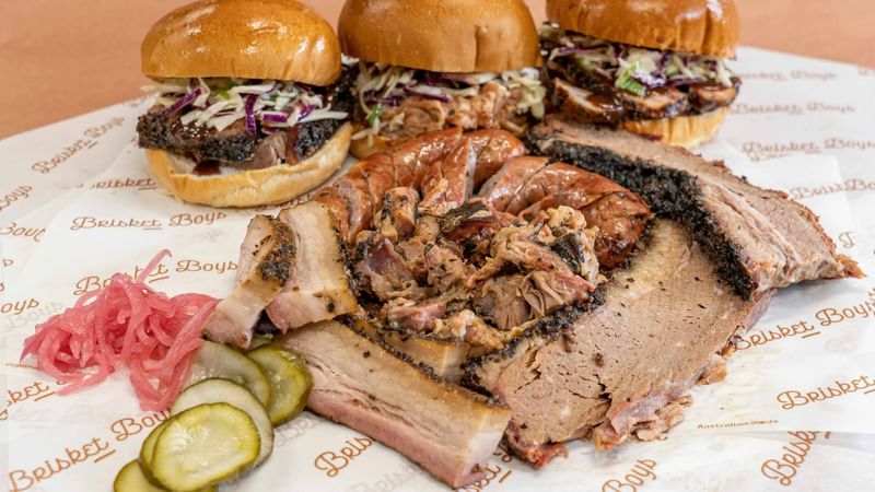 Pulled pork and brisket sandwiches with pickles at Brisket Boys restaurant located near Penrith's Mercure Hotel.