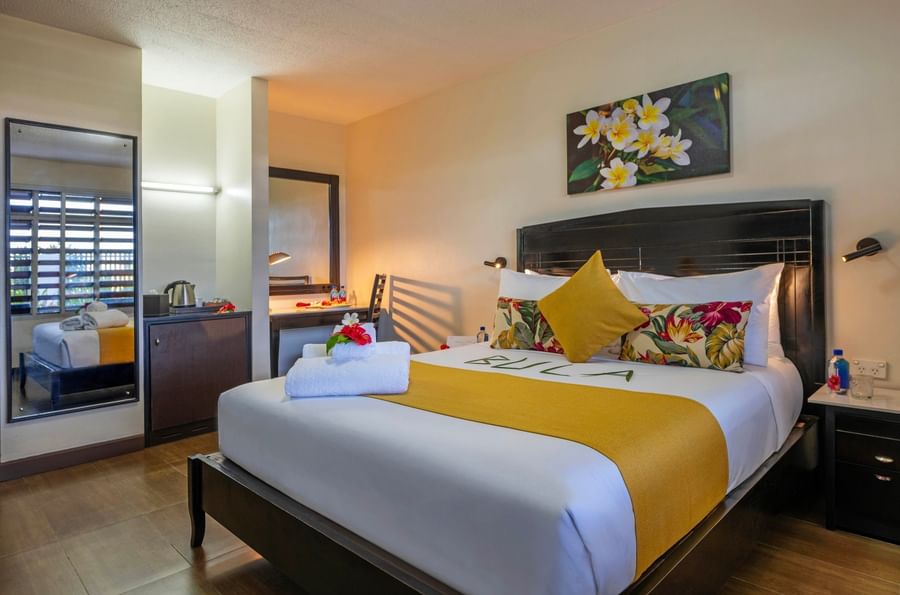 Clean and comfortable hotel room with a king bed at Tokatoka Resort Fiji International Airport.