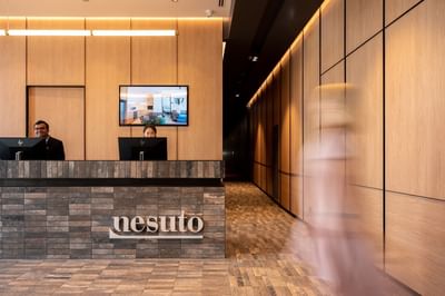 Receptionists by the front desk at Nesuto Docklands
