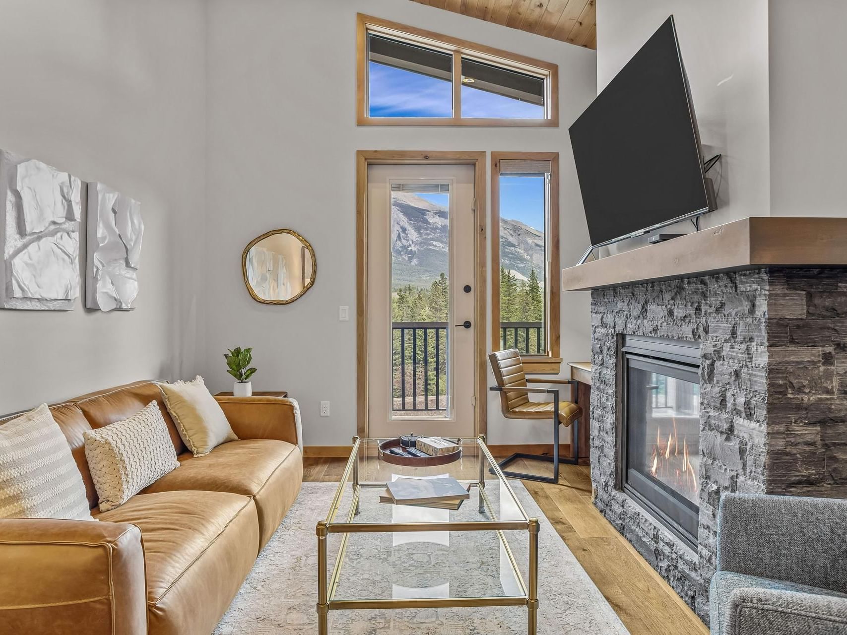 406 Timberstone Lodge One Bedroom Elevated Condo with fireplace, and leather sofa at Spring Creek Vacation Homes Canmore