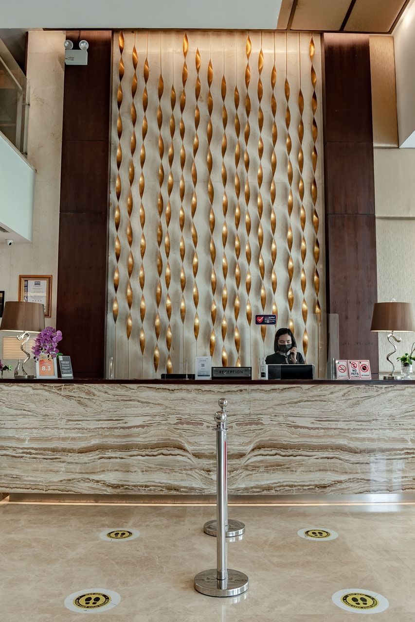 Receptionist in the front desk at LK Hotel Simpang Lima