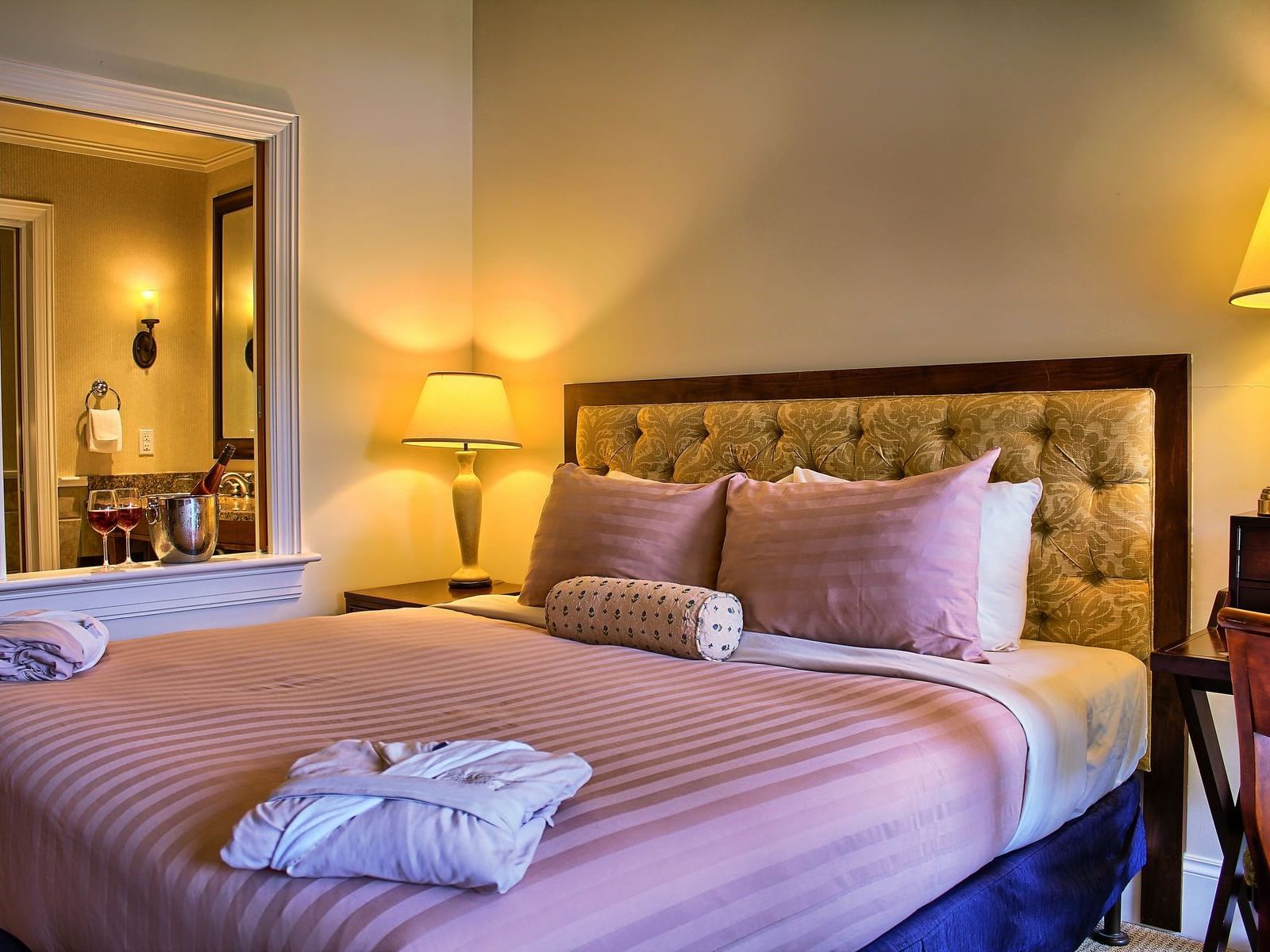 King bed with side tables in King Lodge Room at Poets Cove Resort & Spa