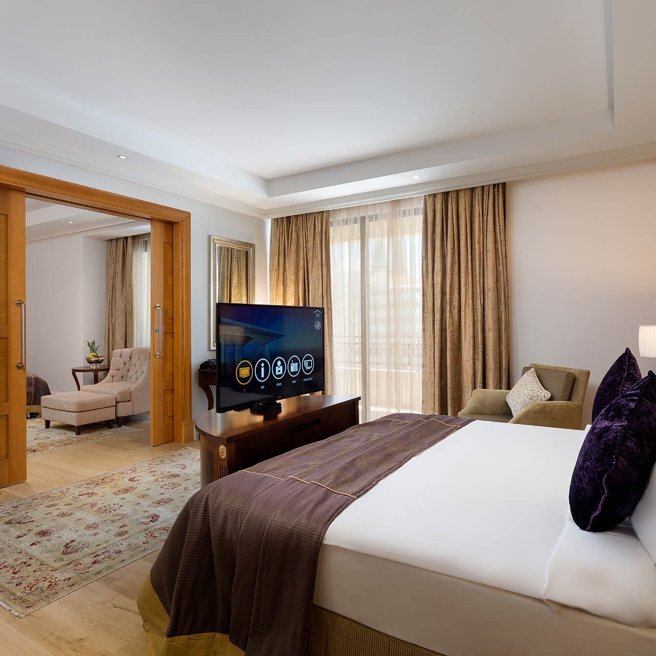 Cozy bed and TV in Family Room at Titanic Mardan Palace
