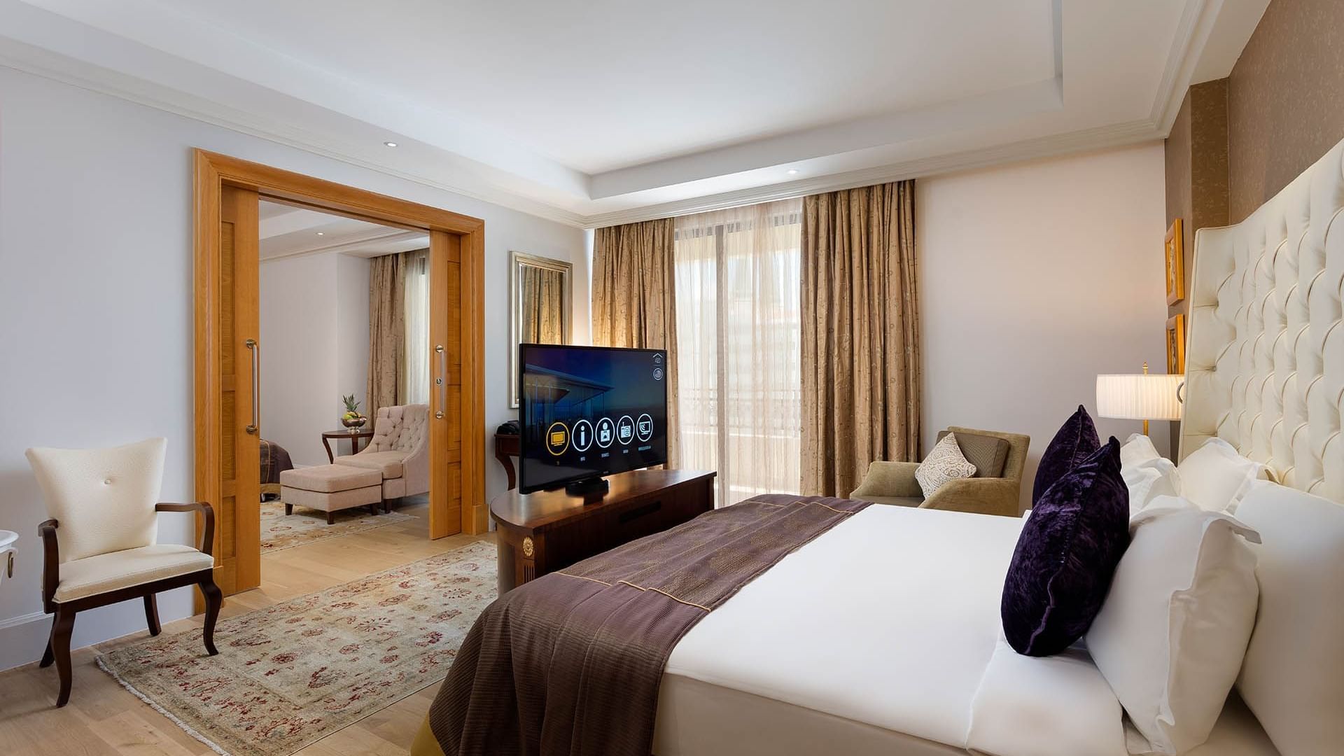 Cozy bed and TV in Family Room at Titanic Mardan Palace