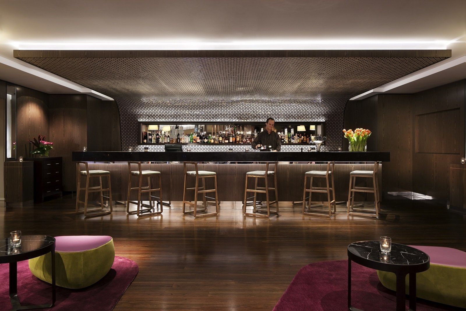 Bar counter in a bar with wooden floors at Pullman Sydney Hyde Park